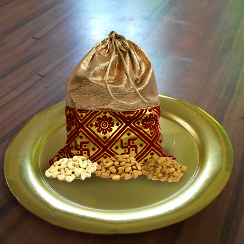 Irresistible Dry Fruits Potli with Stylish Thali in Golden Color