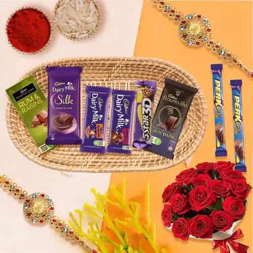 Gift Hamper of Cadbury Chocolates with Red Roses with 2 Rakhi, Roli, Tilak and Chawal