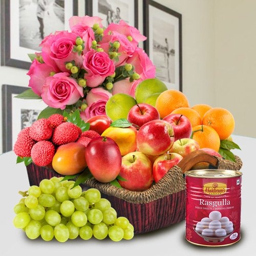 Fresh Fruits in a Basket with Haldiram Rasgulla and Pink Rose Bouquet for Mom