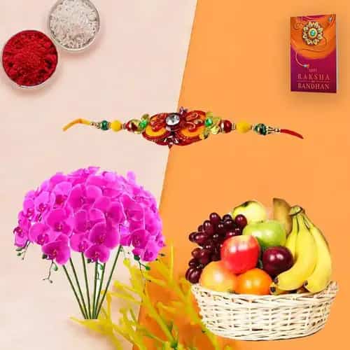 Tropical Fresh Fruits Basket decorated with Orchids with 1 Regular Rakhi and Roli Tilak Chawal