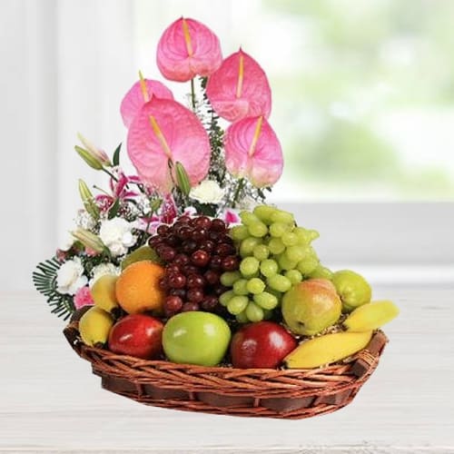 Garden-Fresh Fruits Basket designed with Anthodium, Lily n Carnations