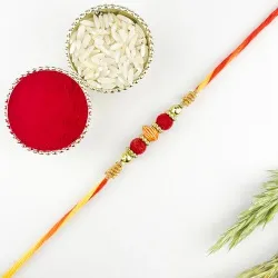 Kalash Pattern Rakhi n Charming Red Beads