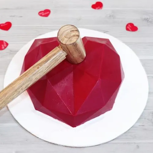 Delicious Red Heart Shape Pinata Cake with Hammer
