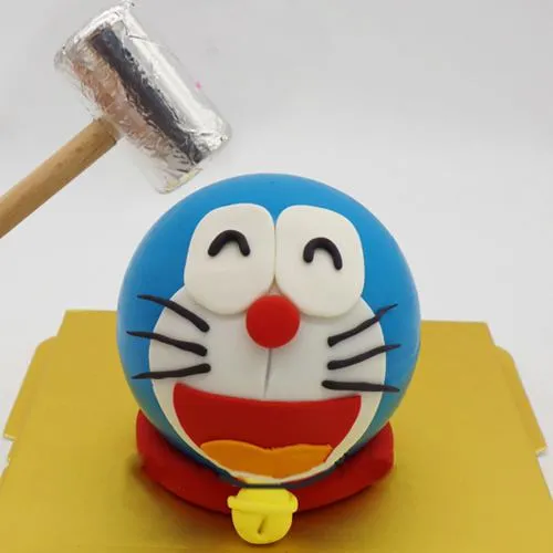 Smily Doraemon Pinata Cake with Hammer