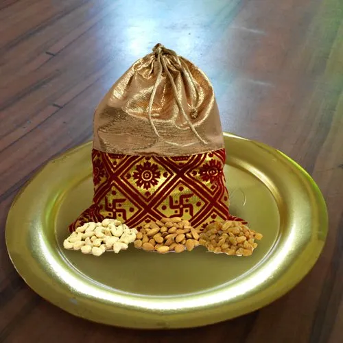 Irresistible Dry Fruits Potli with Stylish Thali in Golden Color