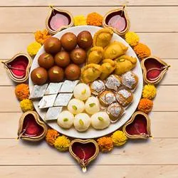 Delicious Assorted Diwali Sweets with Diya