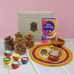 Alluring Gift of Thali with Flavored Cashew Cadbury Chocolates n Diya