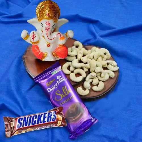 Enticing Marble Ganpati Idol with Dry Fruits n Chocolates