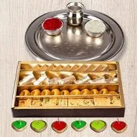 Silver Puja Thali Diya N Haldirams Assorted Sweets.