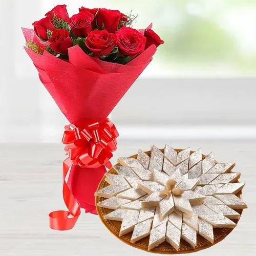 Lovely charming Red Roses combined with mouthwatering Kaju Katli