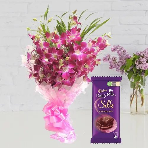 Adorable Bouquet of Orchids and Cadbury Dairy Milk Silk
