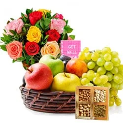 Exclusive Gift of Assorted Fruits Basket with Dry Fruits N Flowers Arrangement