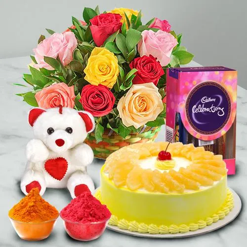 Nicely Gift Wrapped Mixed Roses Basket with Teddy Chocolate and Pineapple Cake 1 lb from Best Local Bakery with free Gulal/Abir Pouch. 
