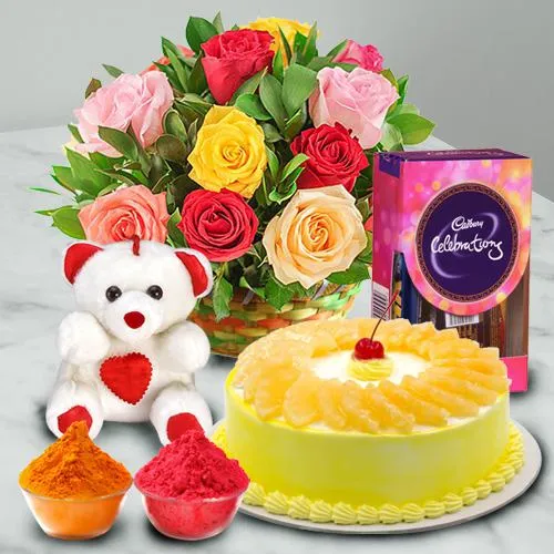 Nicely Gift Wrapped Mixed Roses Basket with Teddy Chocolate and Pineapple Cake 1 lb from Best Local Bakery with free Gulal/Abir Pouch. 
