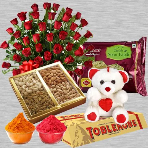 Nicely Gift Wrapped 50 Red Roses Basket Mixed Dry fruits 500 gms. Haldiram's Soan Papdi 500 gms. a small Teddy Bear and Toblerone bar 4 Pcs with free Gulal/Abir Pouch.