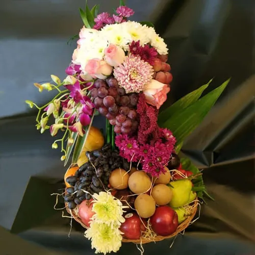 Attractive Tall Arrangement of Flowers n Fruits