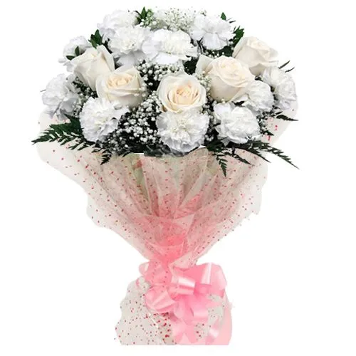 An exuberance of White Roses N Carnations