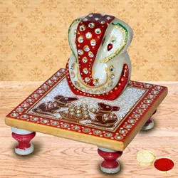 Delicately carved marbel designer ganesh with chowki with free Roli Tilak and Chawal