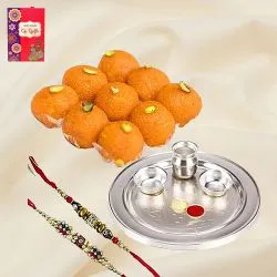 Delectable Haldirams Ghee Ladoo with Silver Plated Pooja Thali N Dual Rakhi Set