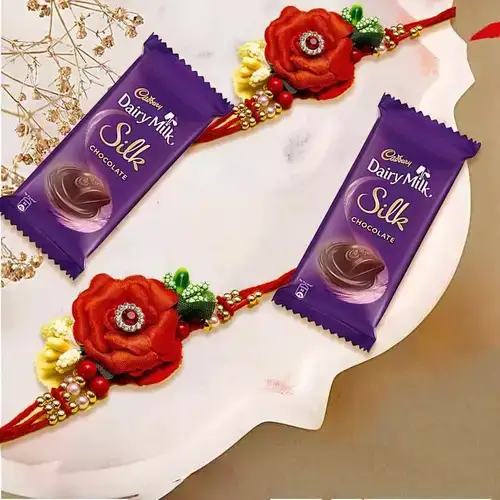 Smashing Twin Flower Rakhi Set with Cadbury Dairy Milk Silk Chocolate Bar