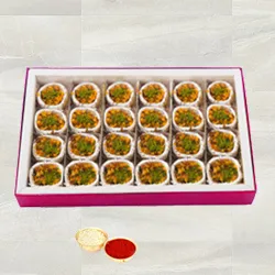 Kaju Pista Premium Sweets from Haldiram with free Roli Tilak and Chawal.