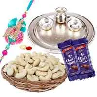 Admirable Rakhi Special Gift of One Silver Puja Thali with One Fancy Rakhi and Spicy Cashew Nuts