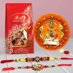 Soothing Pair of Rakhi with Lindt Chocolates n Puja Thali