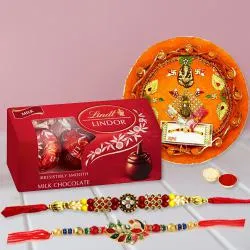 Charming Rakhi Pair with Lindt Chocolates n Puja Thali